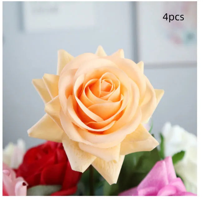Artificial silk flower bouquet with red petals and green leaves measuring 42cm long
