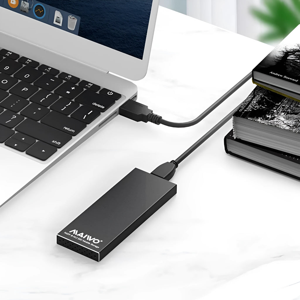 USB 3.0 M.2 SSD enclosure in aluminium alloy, black colour, on a table with USB cable