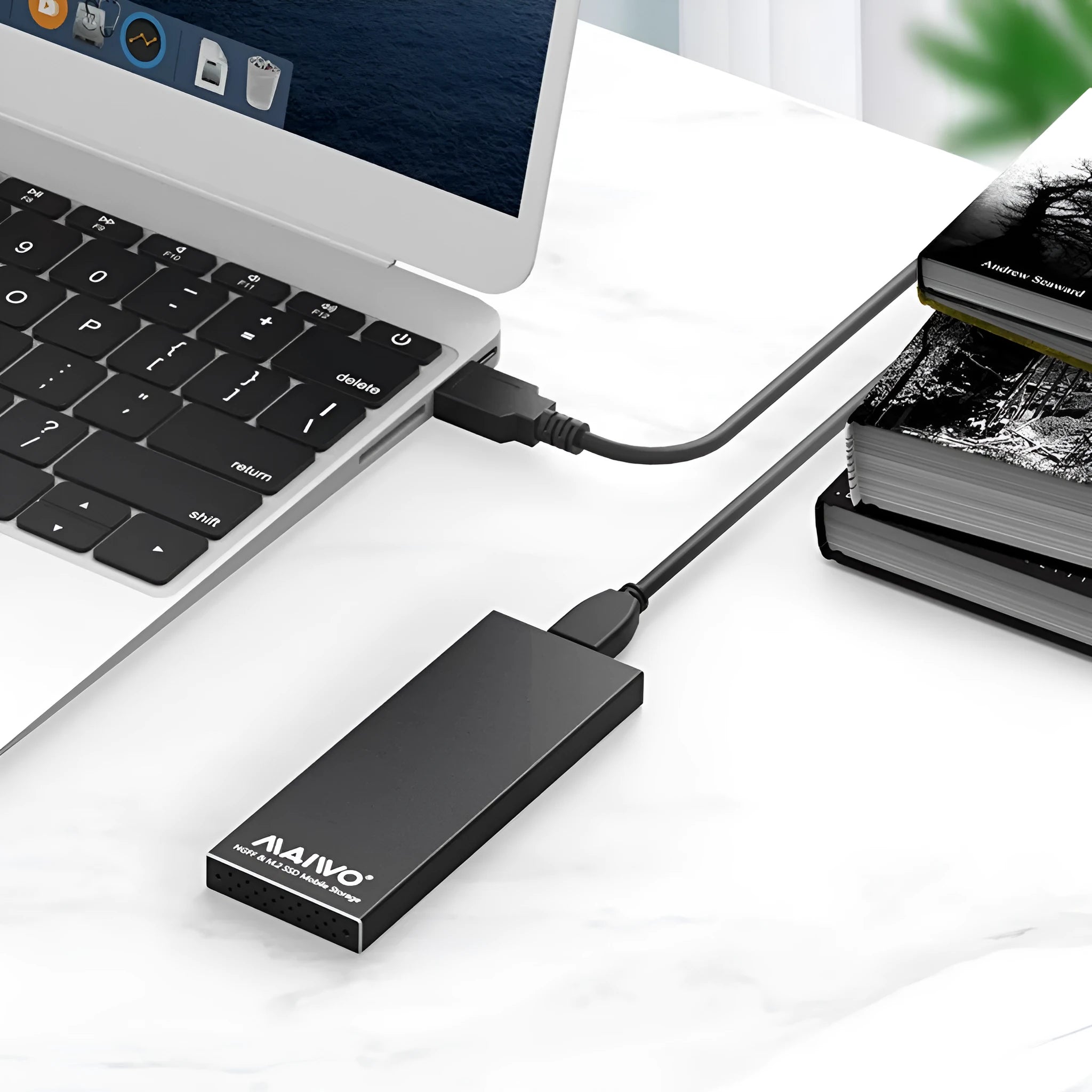 USB 3.0 M.2 SSD enclosure in aluminium alloy, black colour, on a table with USB cable