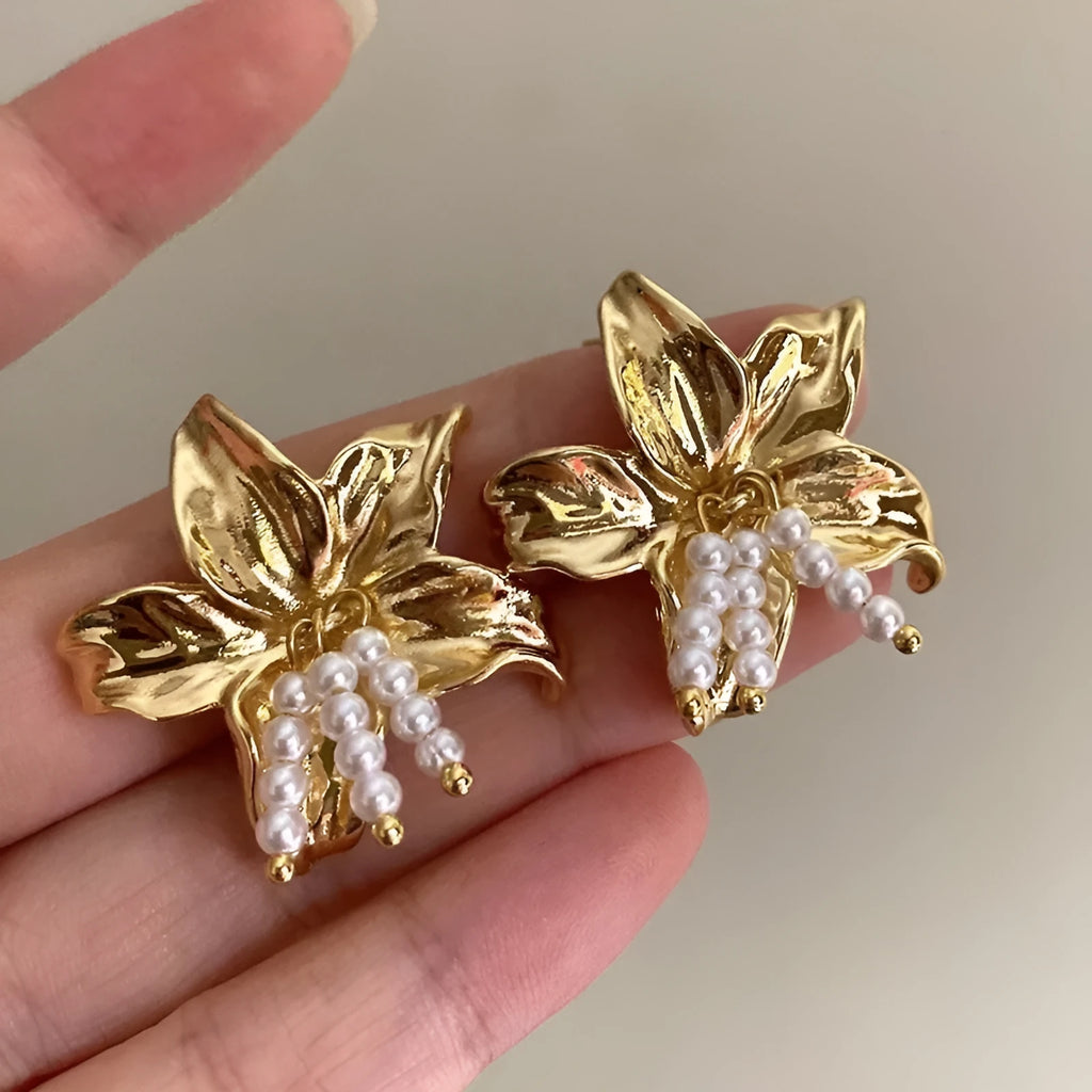Gold H1795 metal flower earrings with pearl design and Seiko treatment