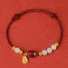 Women's Hetian jade cinnabar red rope bracelet with 925 silver charm and adjustable chain