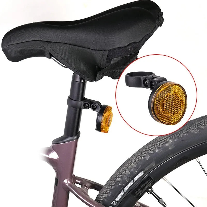 Red plastic positioning anti-theft taillight bracket attached to bicycle seat post