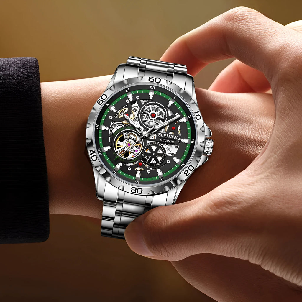 Silver automatic skeleton watch with stainless steel strap and transparent caseback showing mechanical movement