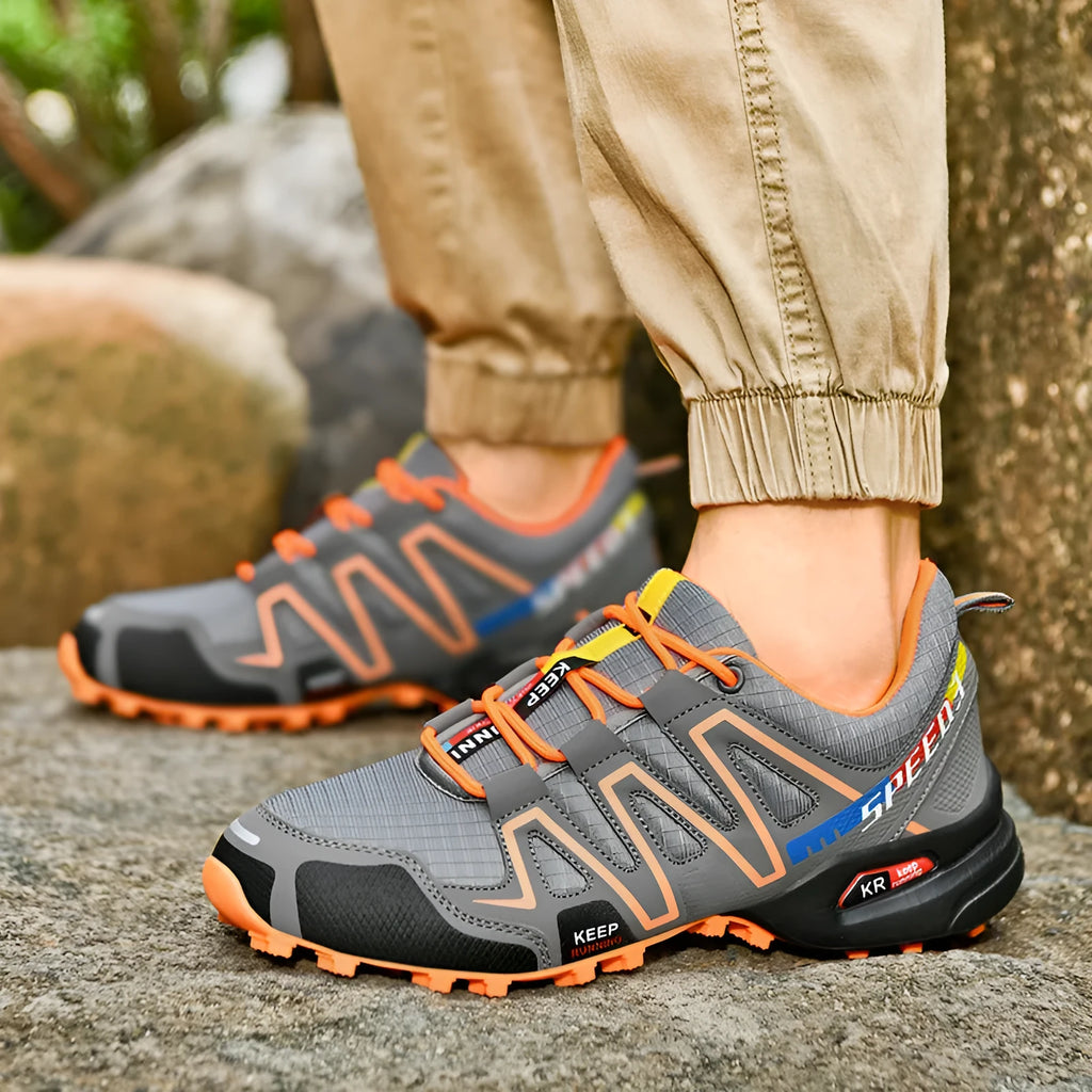 Men's plus size low-top casual running shoes in grey orange colour with synthetic leather upper and rubber sole.
