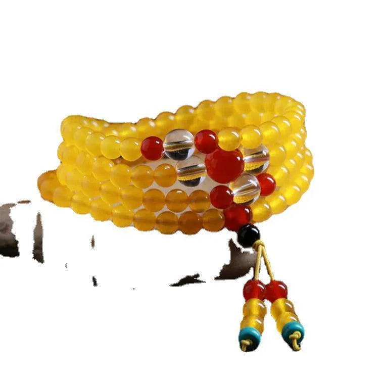 Polished crystal canary stone 108-bead geometric necklace with Lucky Cat detail on white background