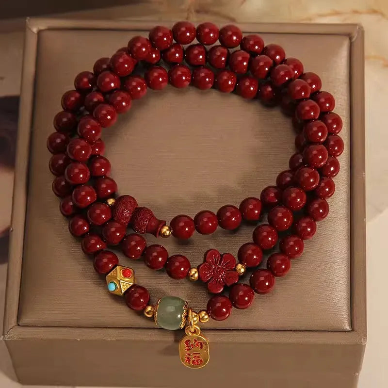 Multi-circle cinnabar bracelet with gourd and five petal flower motifs, polished finish, 6mm beads