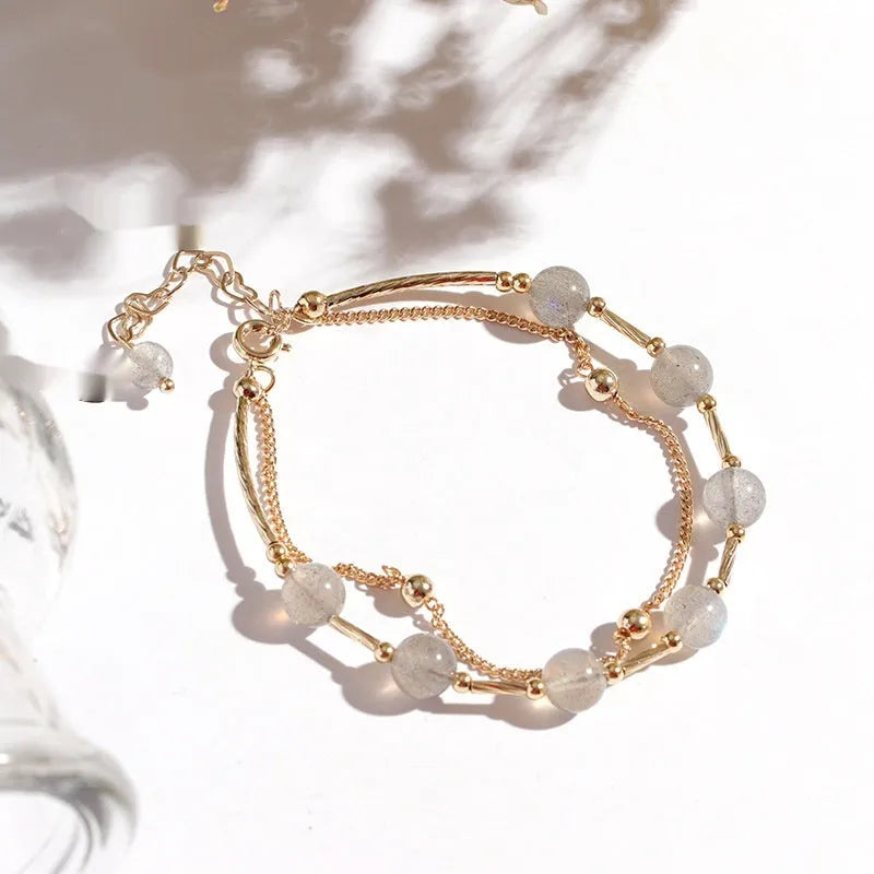 Crystal bracelet with double-layer copper tube and moonstone finish on white background