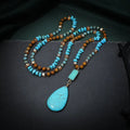Turquoise blue geometric pendant necklace with ball bead chain measuring 81cm length