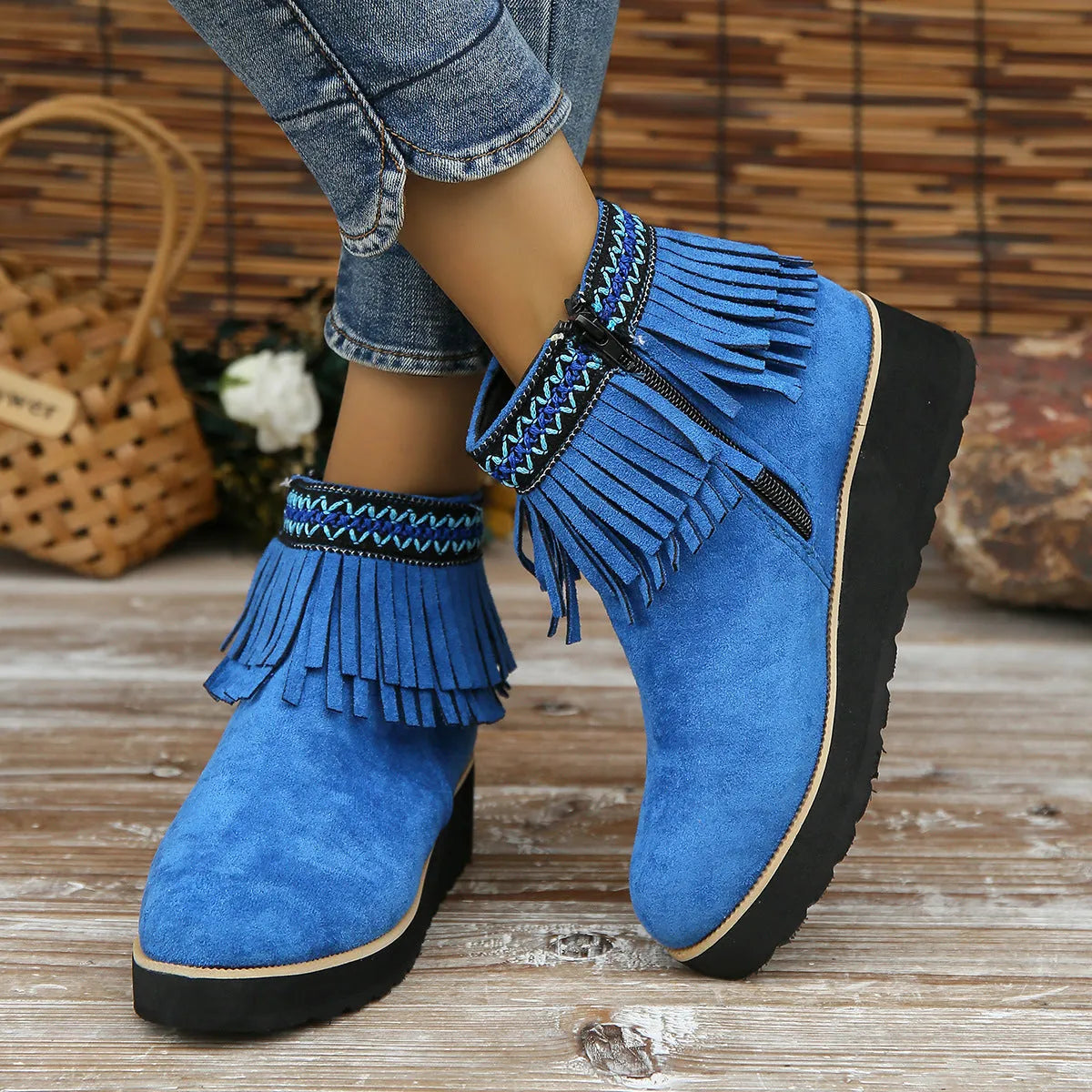 Women's suede wedge booties with side zipper, thick rubber sole, and tassel detail in black colour