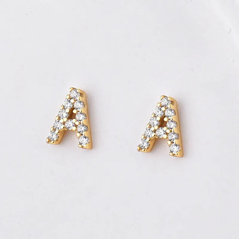 Brass gold plated alphabet letter earrings showing A to Z range on copper with zircon details