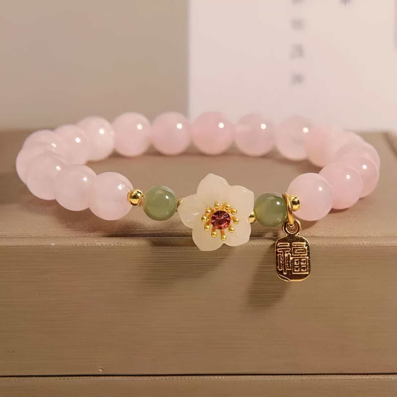 Crystal Hetian jade beaded bracelet with polished fruit shape beads and camellia element in blessing card colour