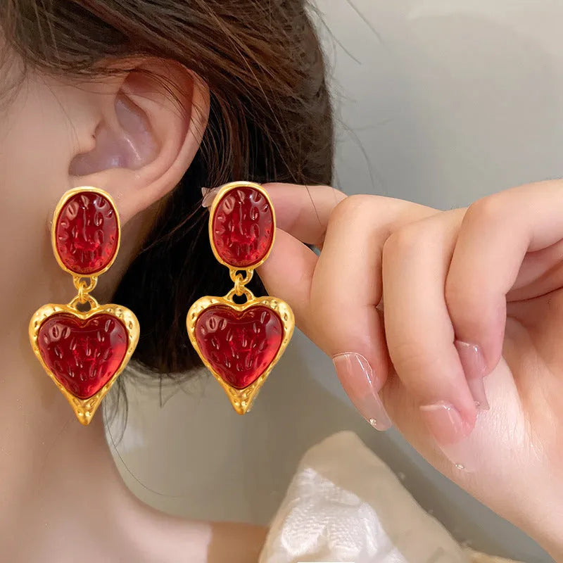 Oval love heart stud earrings with pleated texture in purple, red, green, and yellow-white colours
