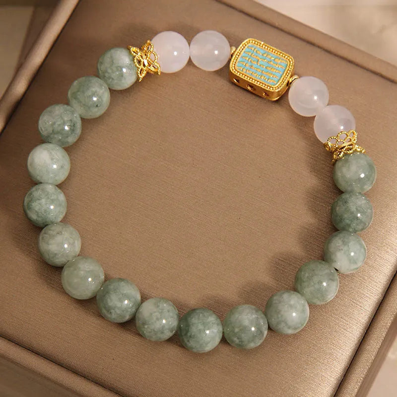 Oil green emerald crystal bracelet with five faceted beads on a string for women.