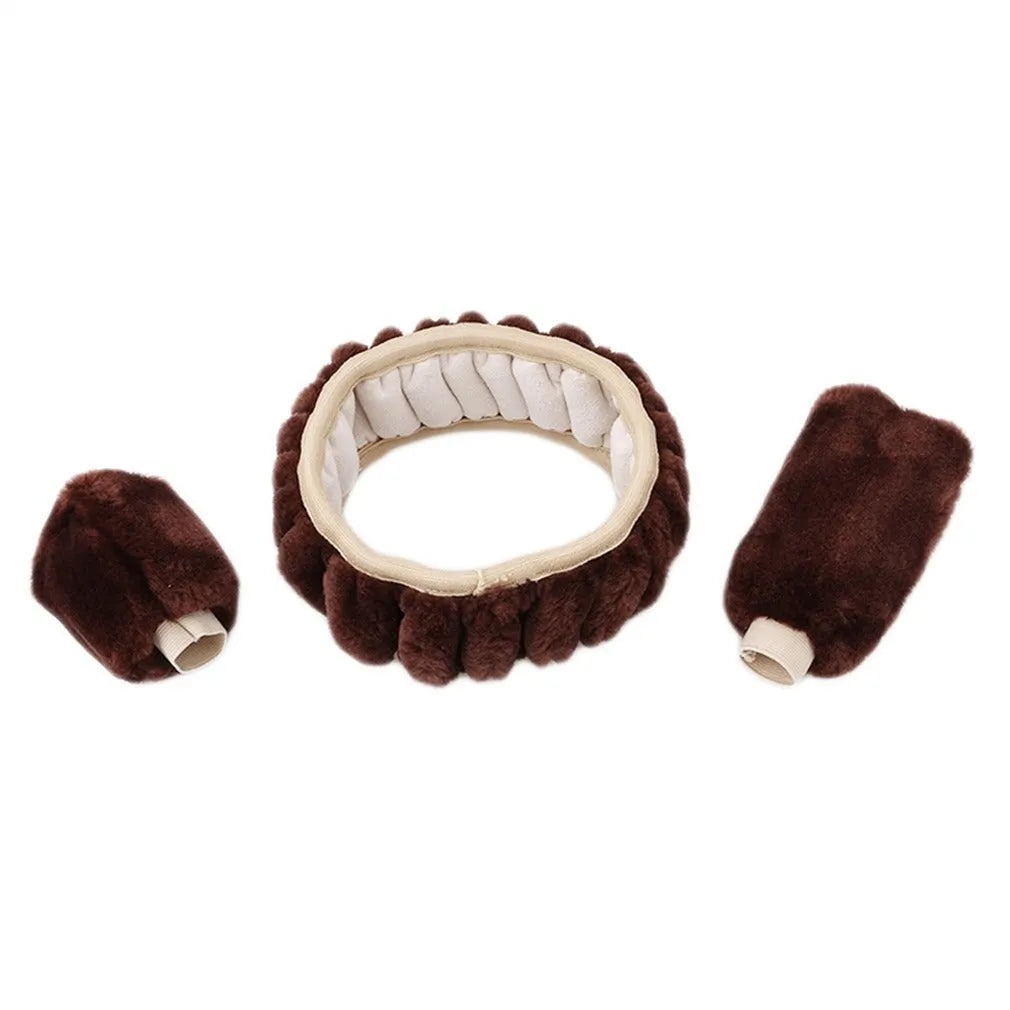 Winter plush car steering wheel cover set in black with matching gear shift and handbrake covers on a dark car interior