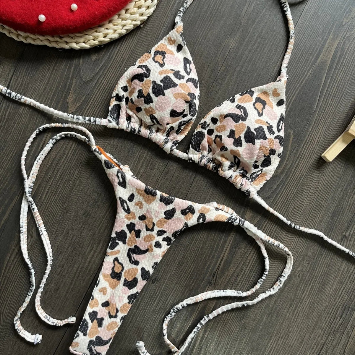 Women's printed bikini swimsuit set with quick-dry fabric on a mannequin, showing briefs style.