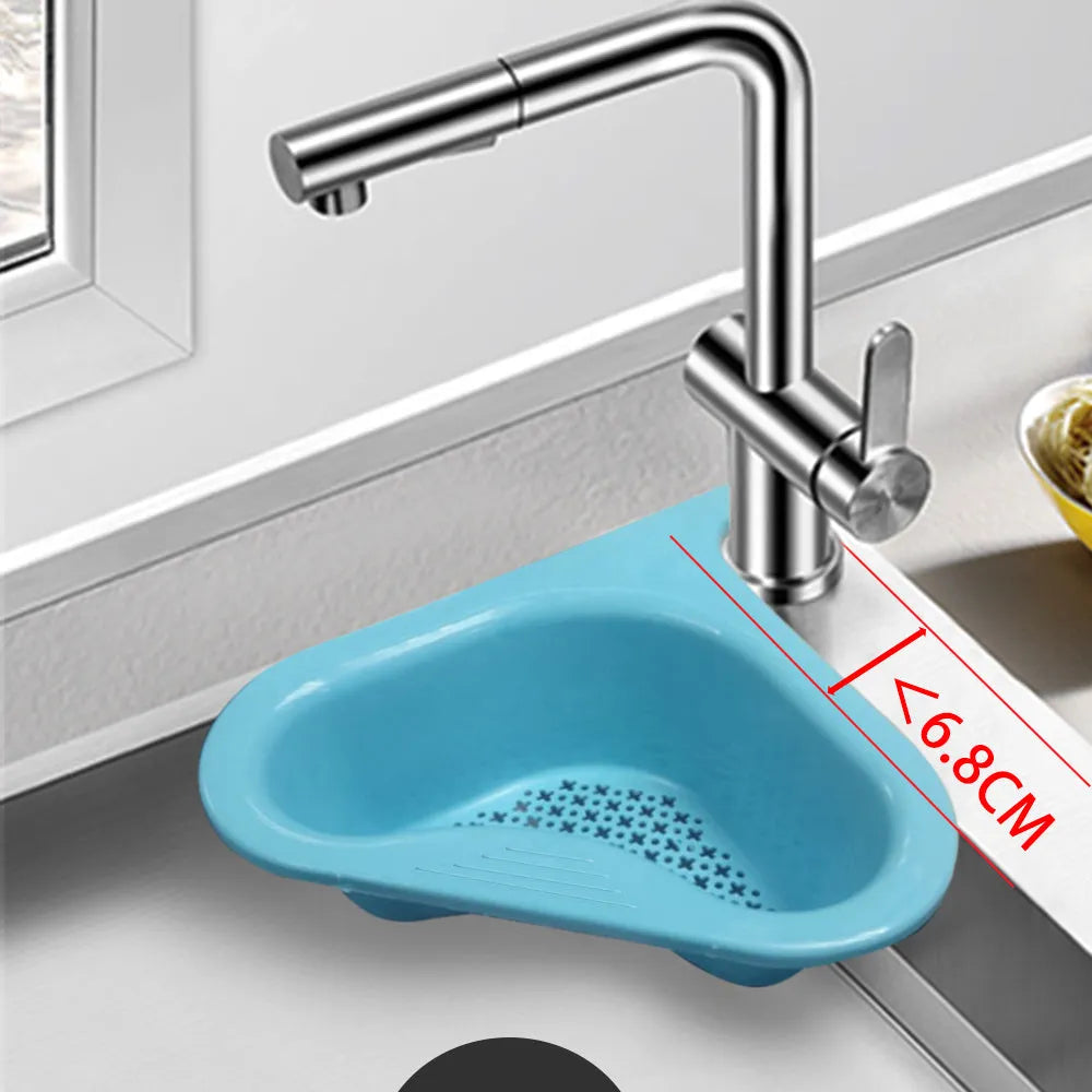 Household sink hanging fruit and vegetable drain basket in green plastic, clipped onto sink rim with slotted base