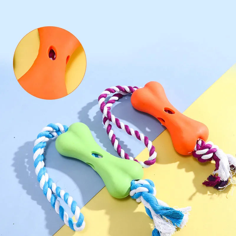 Red porous bone rope knot dog toy with treat-holding centre on white background