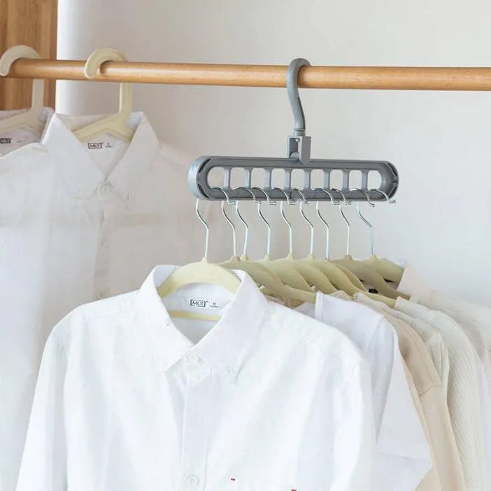 Plastic clothes hanger with 360° rotating hook, 33 cm long, in green colour on white background