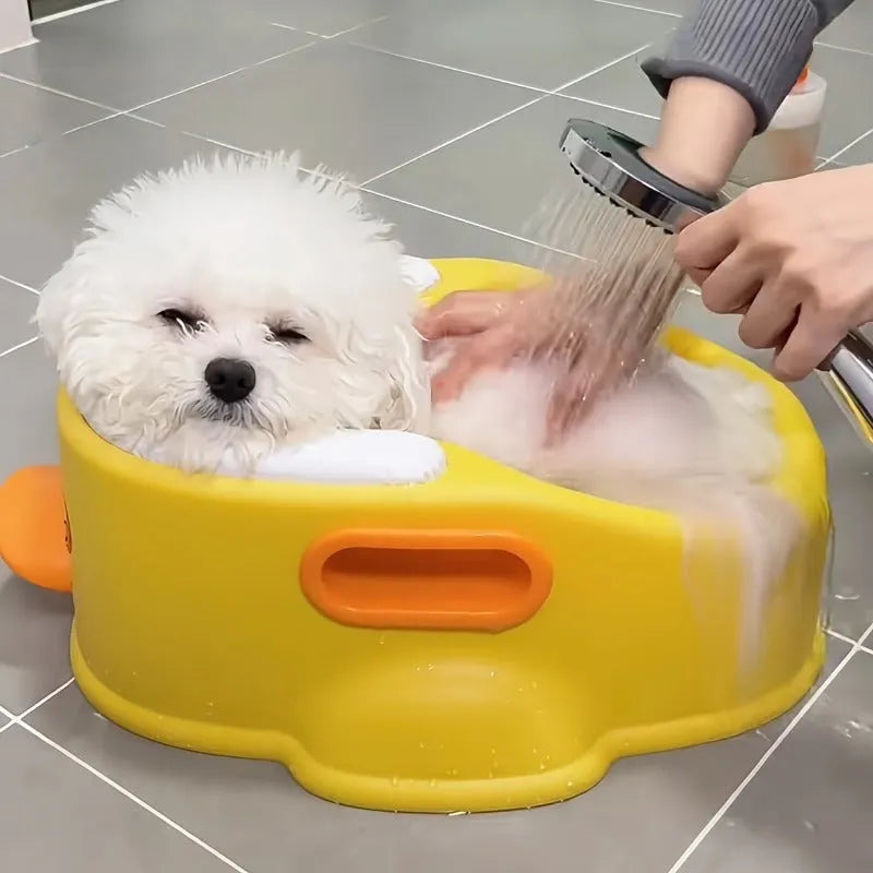 Blue PVC duck-shaped bathtub for washing small dogs and cats on a white background