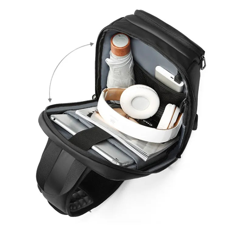 Black PVC outdoor shoulder bag showing computer pocket, air cushion strap, and square vertical design