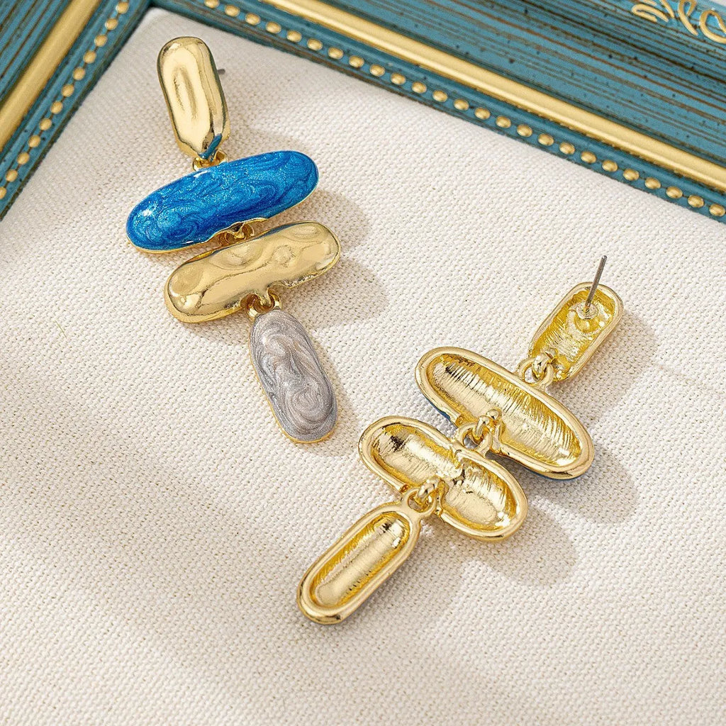 A pair of simple geometric stud earrings with a multicolour metallic electroplated finish.