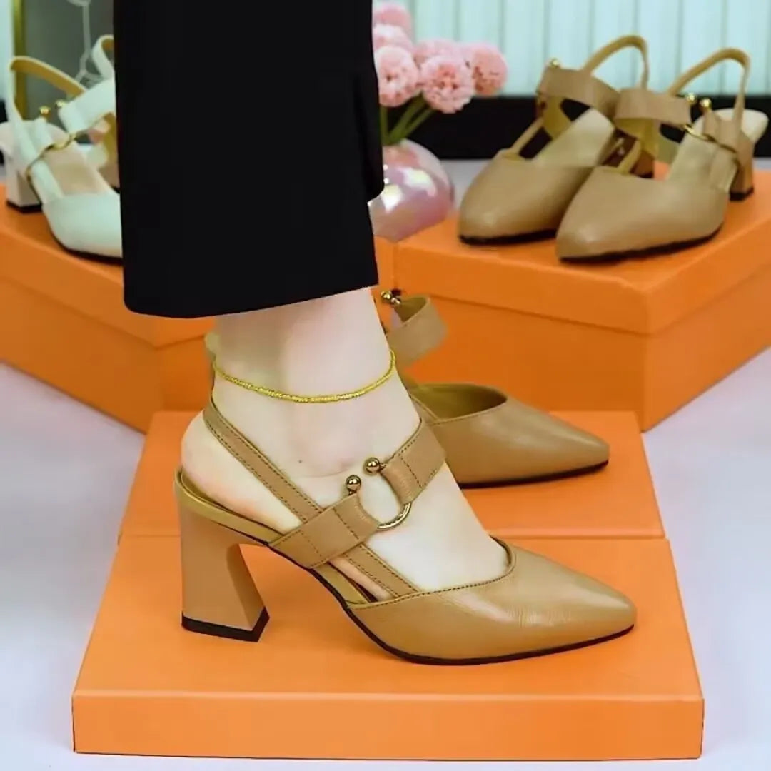 Women's apricot leather closed toe backless sandals with a chunky high heel on a white background.