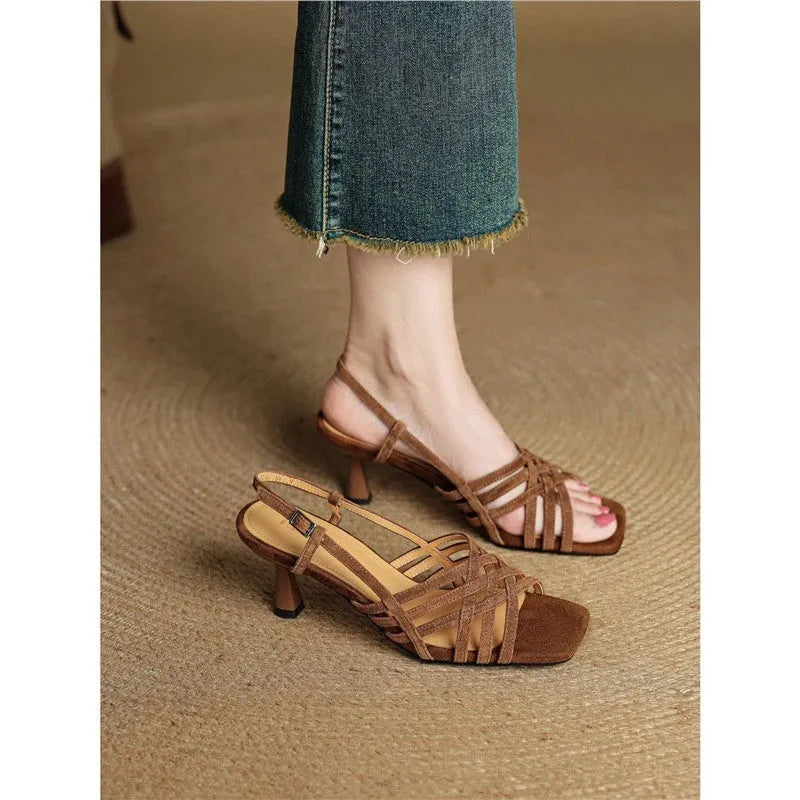 Retro women's sandals with thin cross straps and square toe, shown in light brown colour with ankle buckle