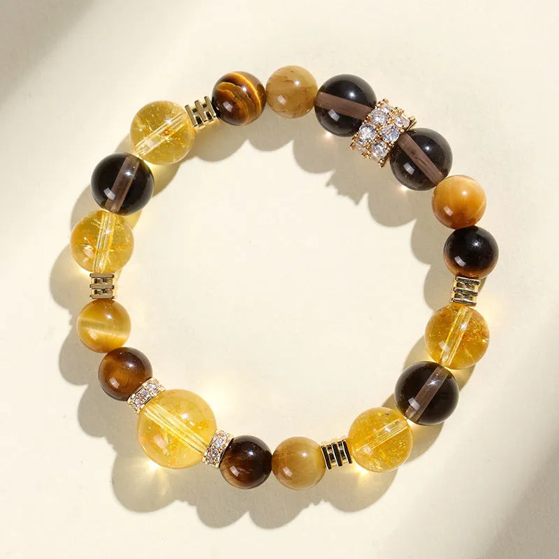Close-up of a women's bracelet with yellow tower-shaped artificial crystal beads on a string.