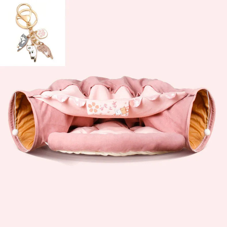 Collapsible pink cloth cat tunnel for small cats folded next to unfolded tunnel