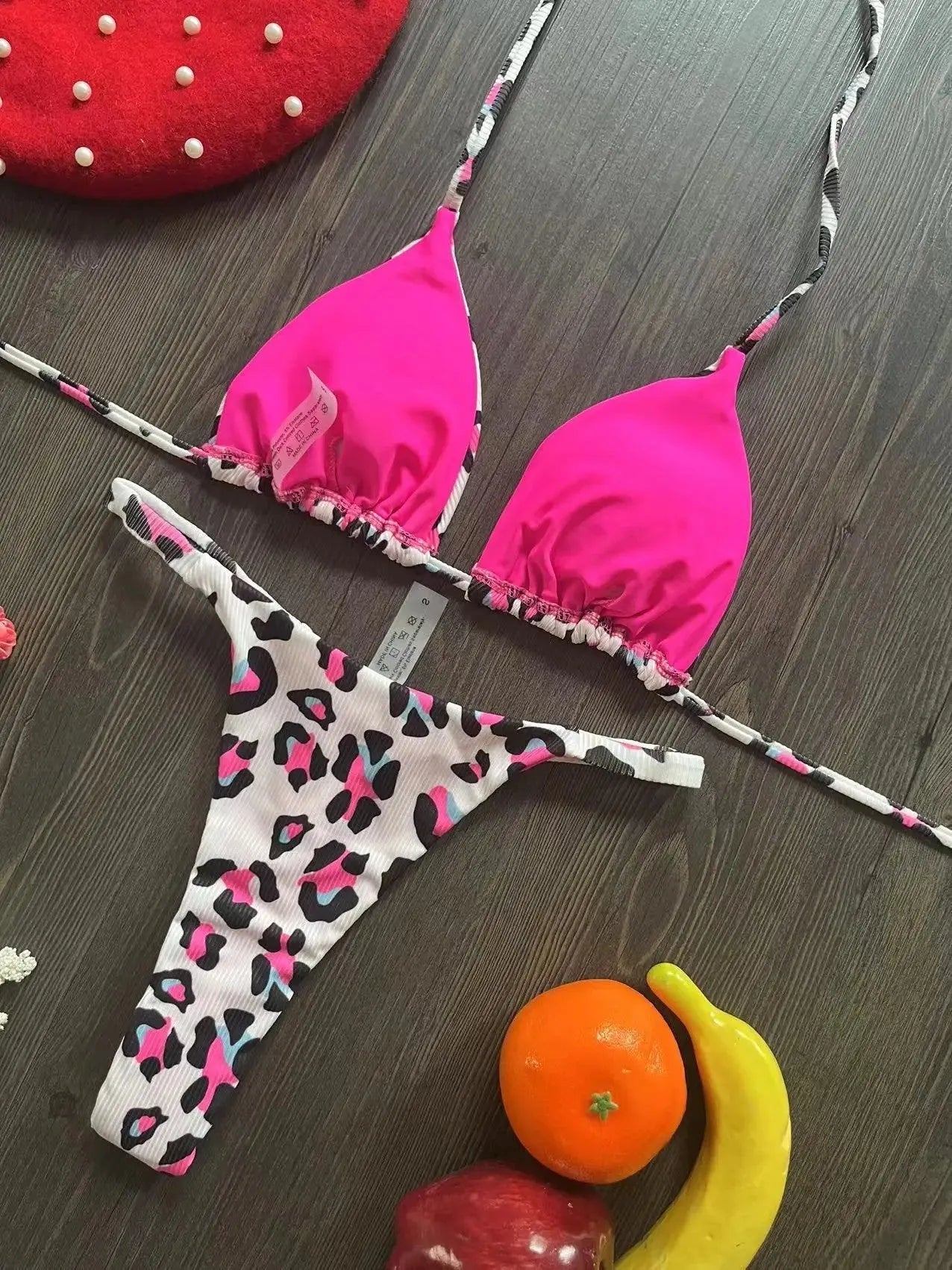 Women's printed bikini swimsuit set with quick-dry fabric on a mannequin, showing briefs style.