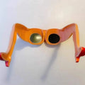 Orange plastic novelty sunglasses featuring a leg and hip design theme.
