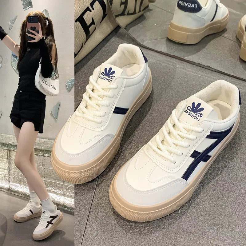 Blue and brown low-top women's borad shoes with patent leather upper and flat rubber sole.