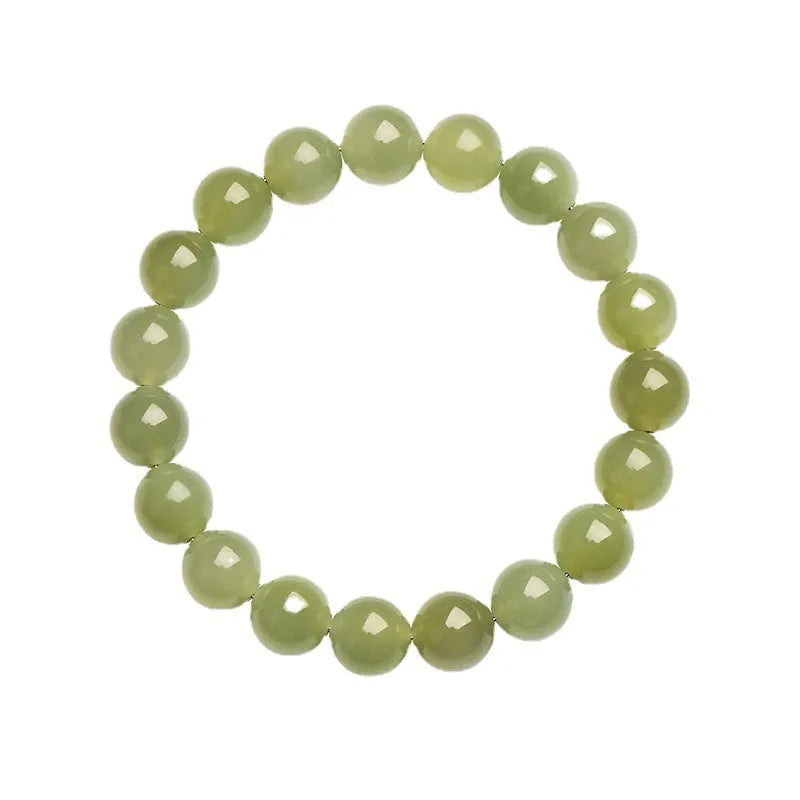 Polished Hetian jade ball bracelet in ice-like clear water colour on a wrist, showing bead detail.