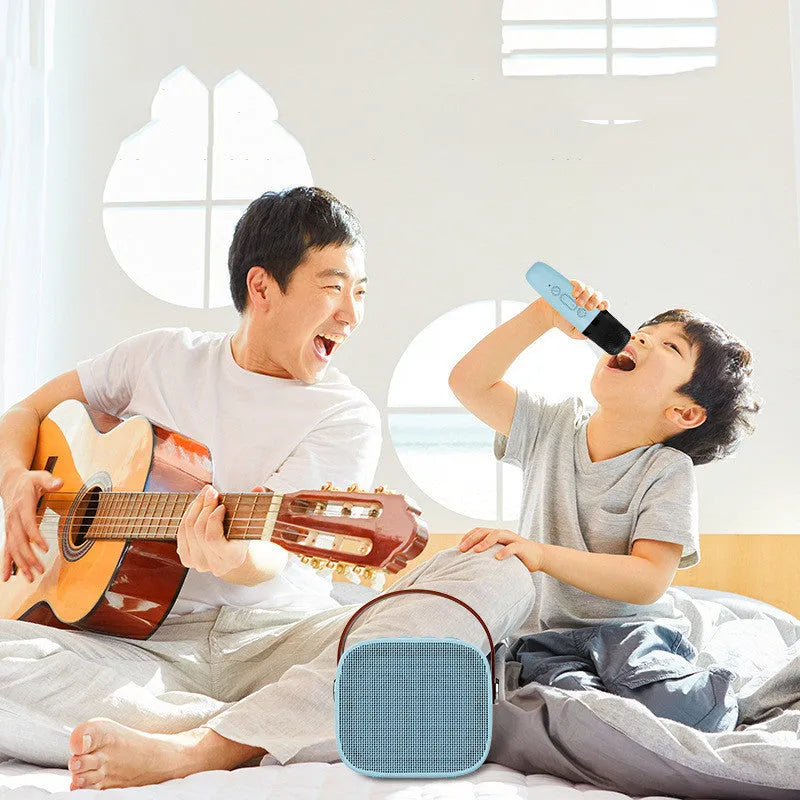 Wireless Bluetooth portable speaker with microphone in plastic shell, available in white pink and blue, with USB charging
