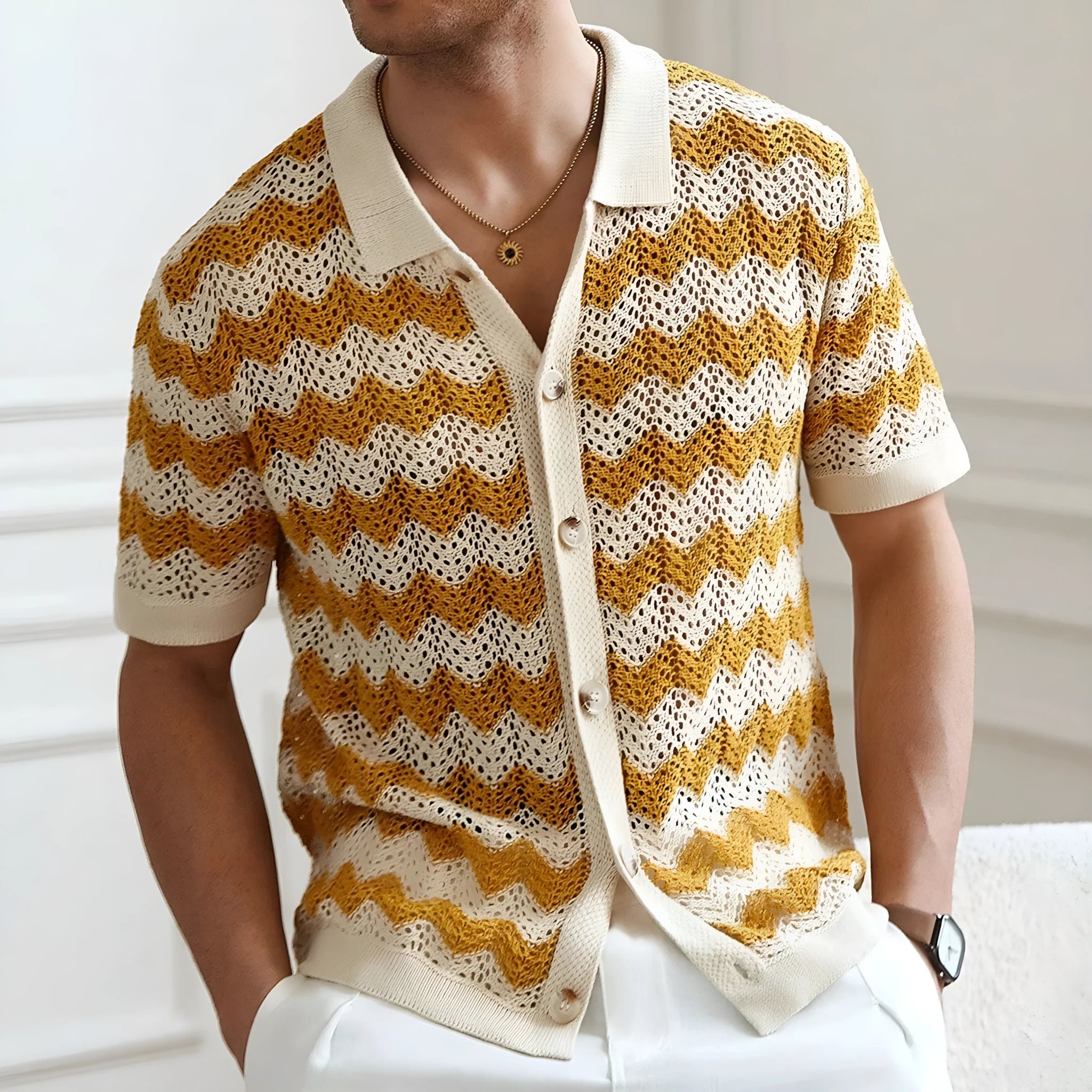 Blue short-sleeve sweater with textured hollow jacquard corrugated pattern and flocking details on a mannequin.