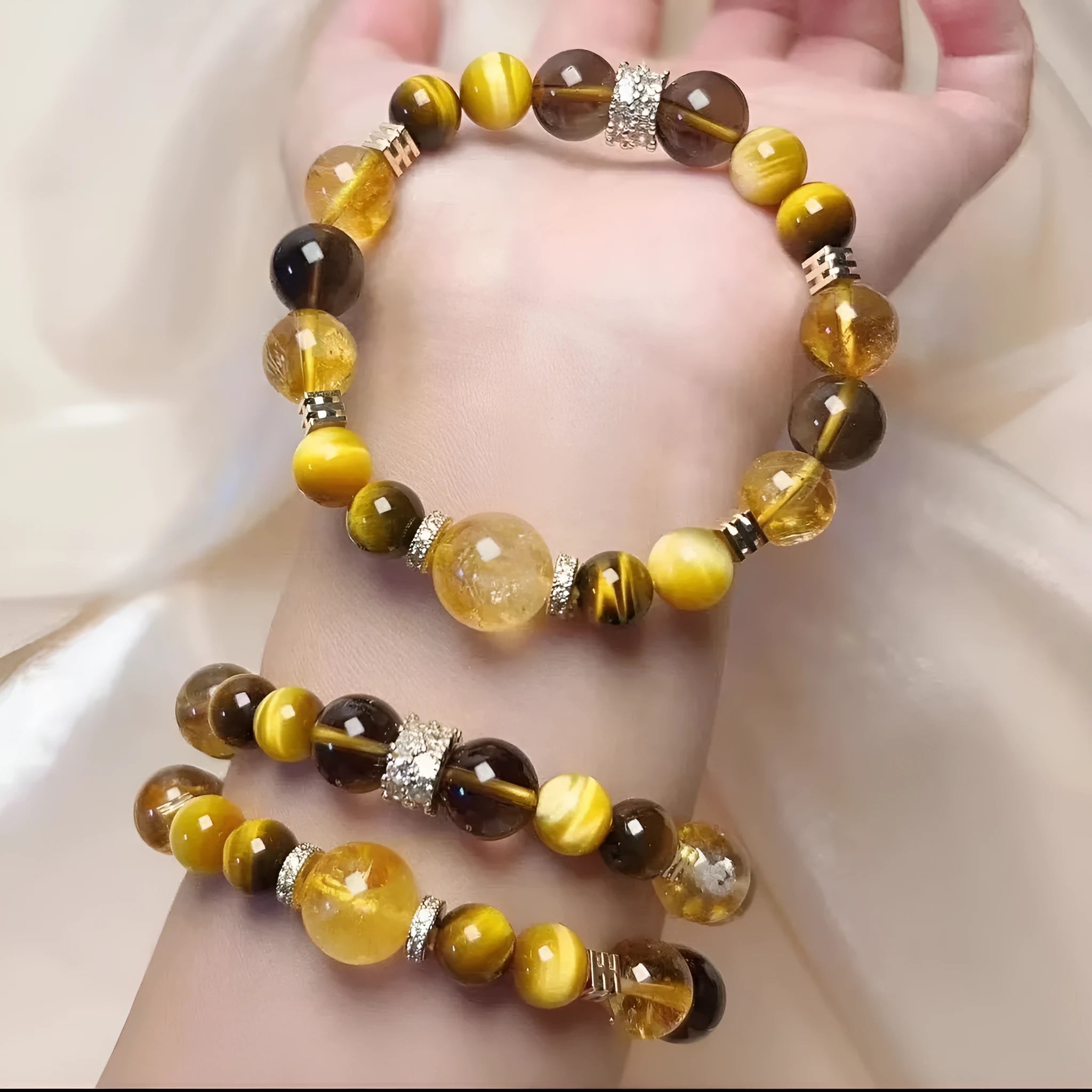 Close-up of a women's bracelet with yellow tower-shaped artificial crystal beads on a string.
