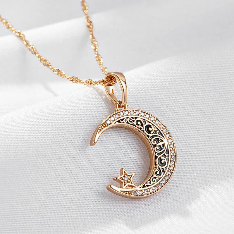 Rose gold star and moon necklace with zircon and enamel pendant on a water wave chain.