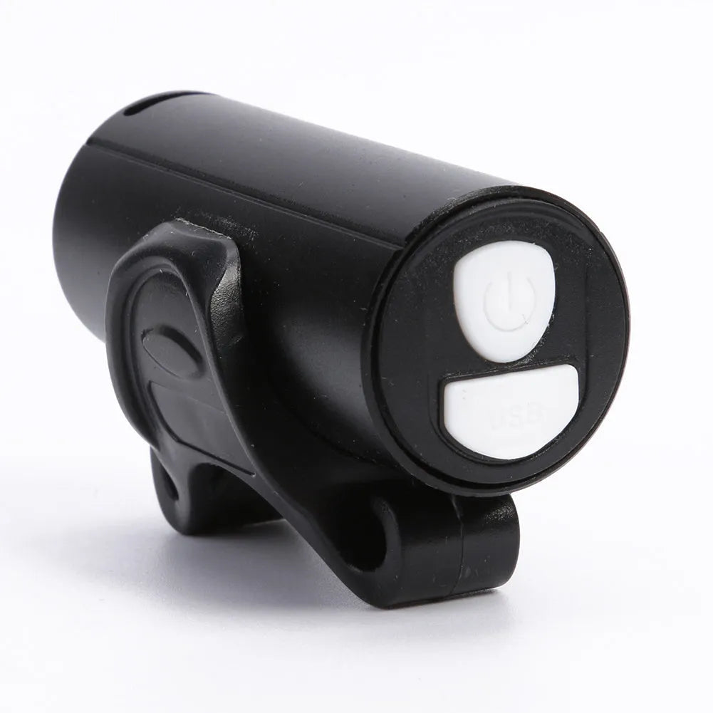 Black rechargeable 350 lumen USB bicycle front light mounted on handlebars for night cycling
