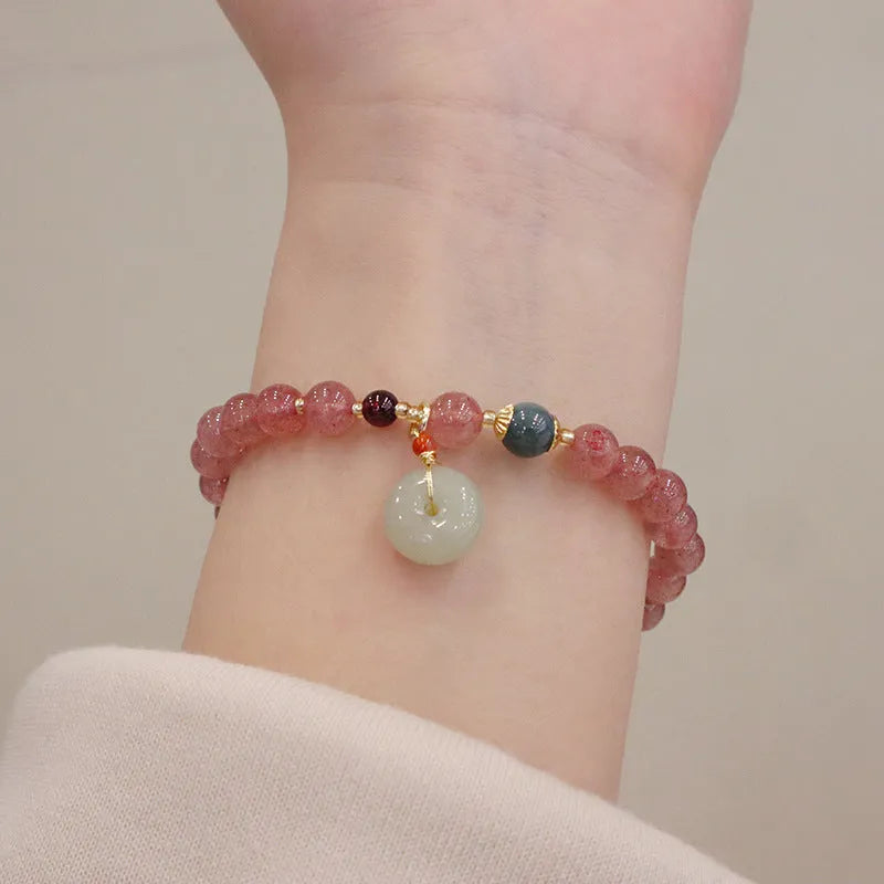 Geometric purse-style strawberry quartz bracelet for women with a peace buckle and safety clasp.