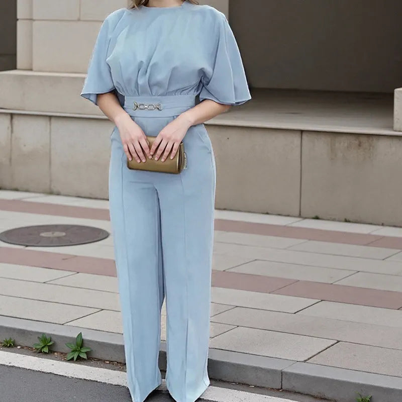 Blue polyester casual suit set with long sleeve top and trousers on a hanger