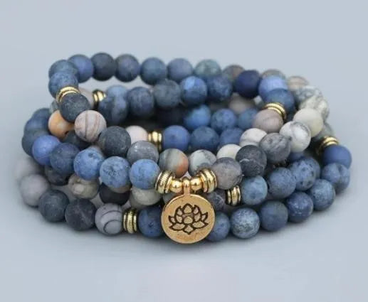 Alloy volcano white turquoise natural stone bracelet with adjustable cord on neutral background