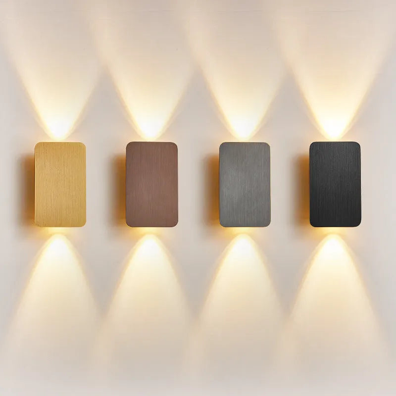 Minimalist modern Nordic metal LED wall lamp in black, mounted on a wall.