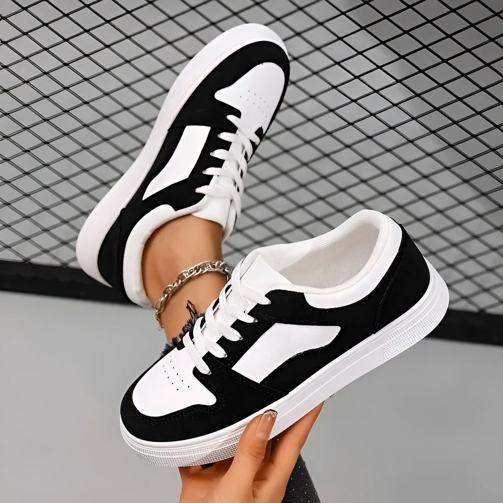 Black women's rubber casual sports shoes with flat heel, low top, round toe, and front lace-up closure