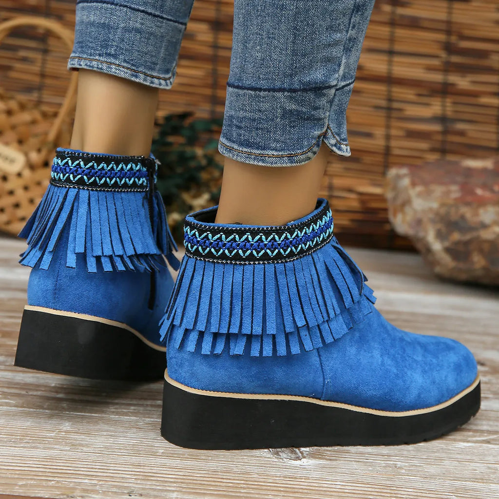Women's suede wedge booties with side zipper, thick rubber sole, and tassel detail in black colour