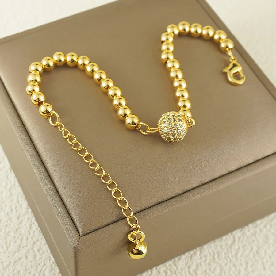 Women's electroplated copper bracelet with heart shape and round ball zircon in Arabic style design