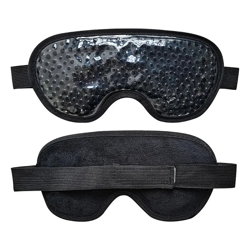 White rechargeable portable eye compress device with a fabric eye mask on a grey background.