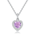 Women's sterling silver heart pendant necklace with a coloured gemstone on an adjustable chain.