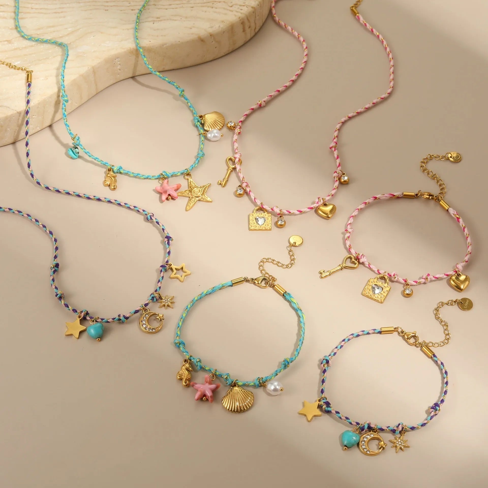 Handmade braided rope titanium steel necklace or bracelet with 18K gold electroplating in purple, pink, or blue styles.