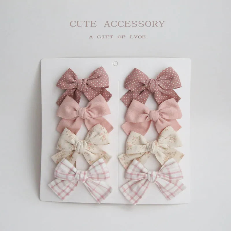 Children's cloth hairclips with dovetail bow design in beige brown grid dots pattern