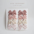 Children's cloth hairclips with dovetail bow design in beige brown grid dots pattern